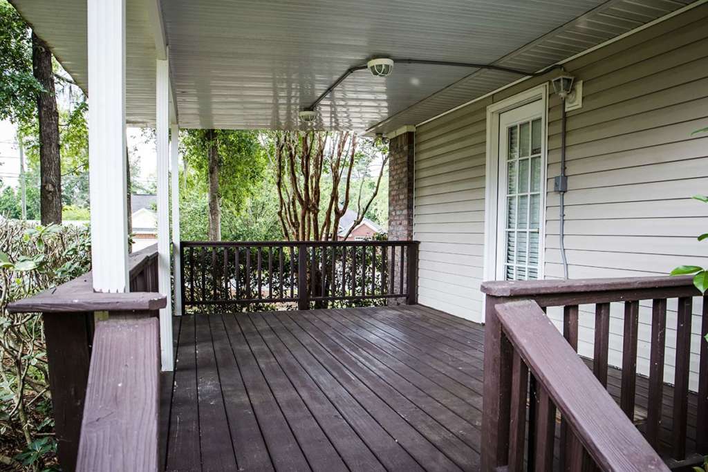Dark stained deck on back of house